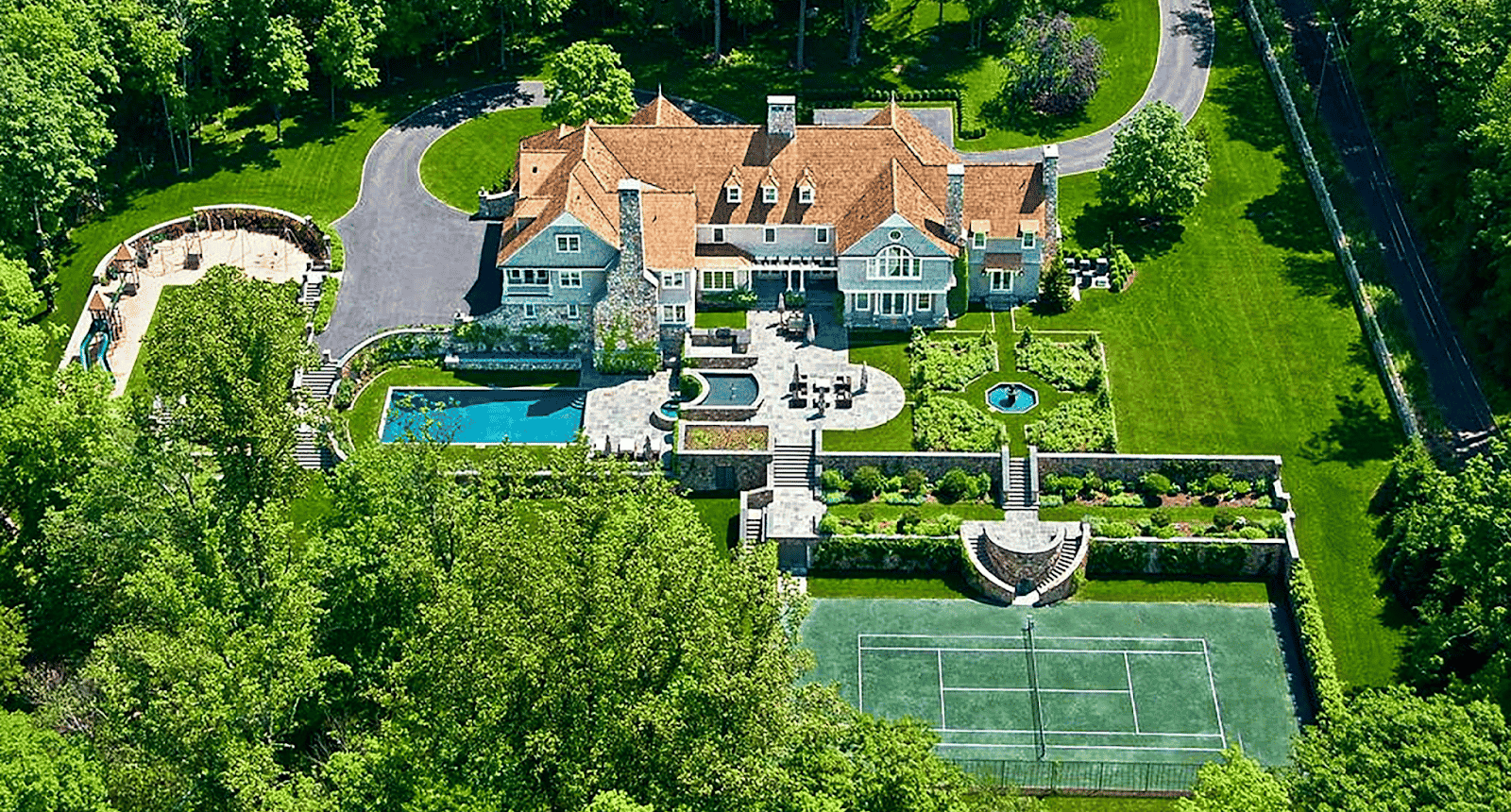 Aerial view of mansion on a large piece of property