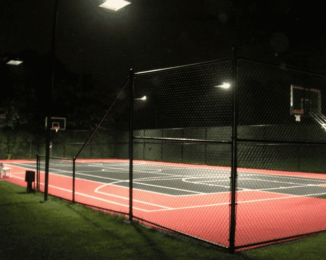 a backyard court built for basketball and a family to enjoy competitive games or practice sports