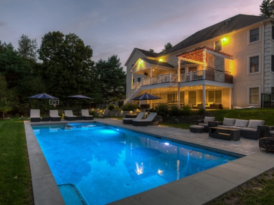 Pool and spa with automatic pool safety cover