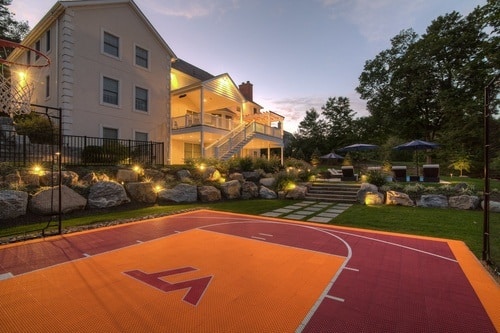 Basketball Court construction in a backyard for a former athlete that wanted to bring his college love home in New York
