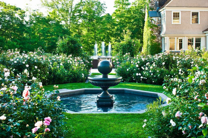 Beautiful view of fountain, flowers, shrubs