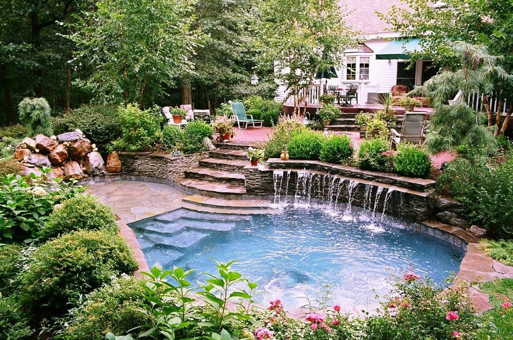 outdoor space with pool built by pool company in orange county