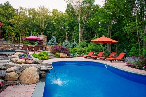 Beautiful landscape design in White Plains, NY showcasing a past clients' pool, patios and gardens