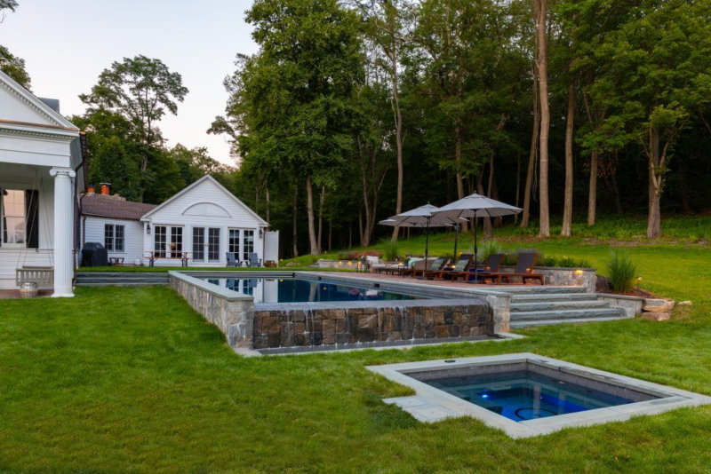 infinity pool construction with hot tub 