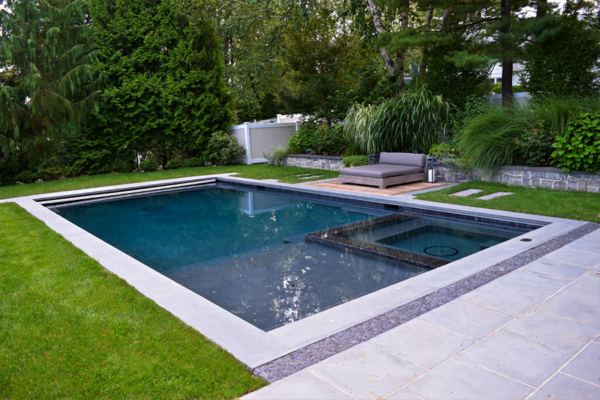 Sleek and elegant outdoor swimming pool boasting a minimalist design, harmonizing simplicity and sophistication effortlessly.